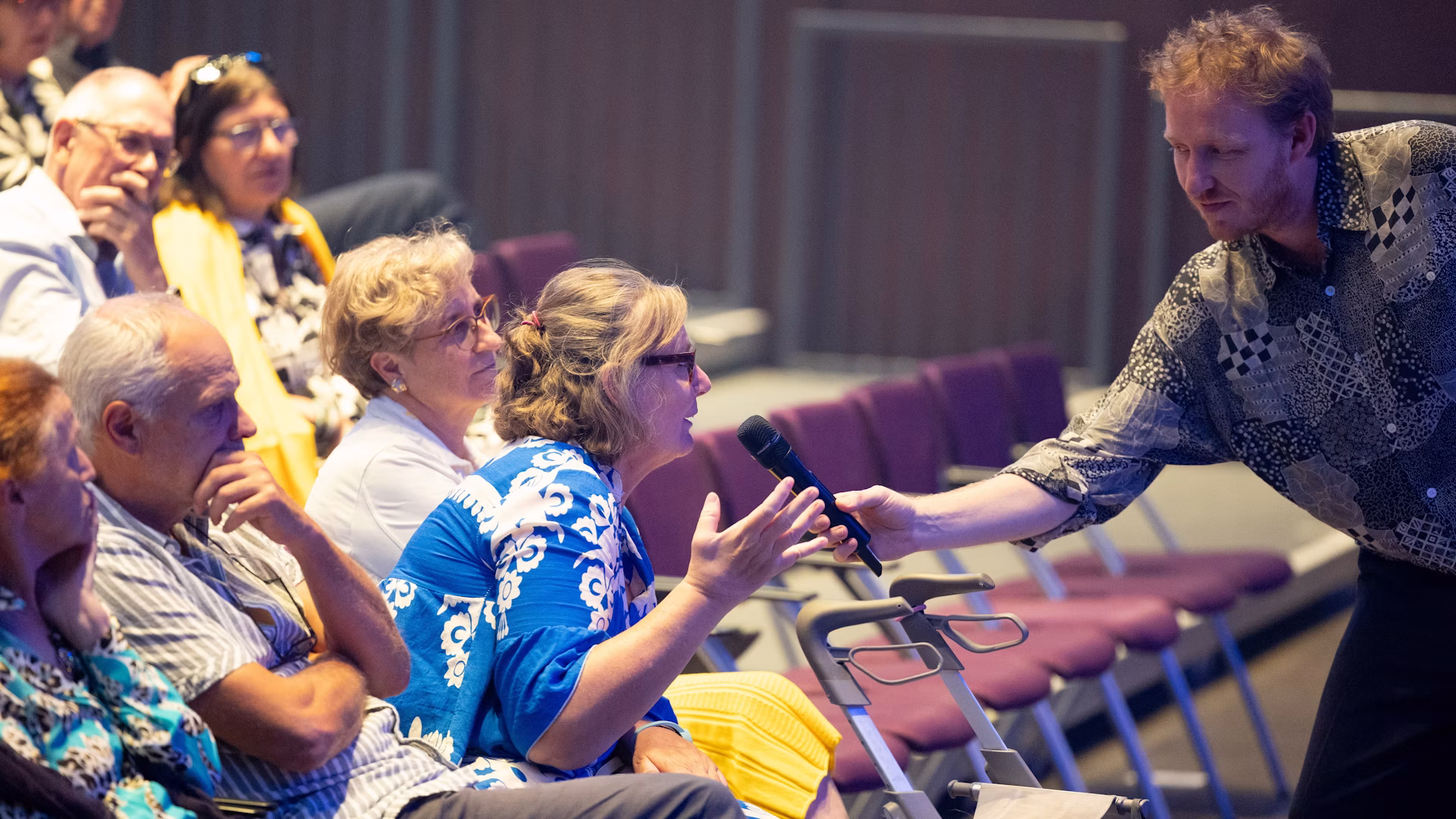 An audience member speaks during a discussion following the Graz presentation.